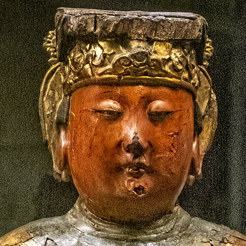 Mozi y el moísmo. Dibujo de Mozi que mira al frente con un rollo de papel en las manos.